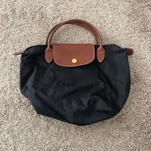 Small Black Longchamp handbag.